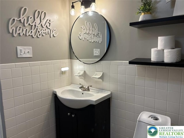 3300 Quarry St Unit B4, Whitehall Twp, PA 18052 - bathroom featuring vanity, tile walls, and wainscoting