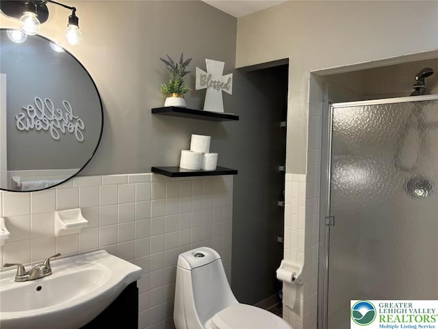 3300 Quarry St Unit B4, Whitehall Twp, PA 18052 - bathroom with tile walls, a shower stall, vanity, and wainscoting