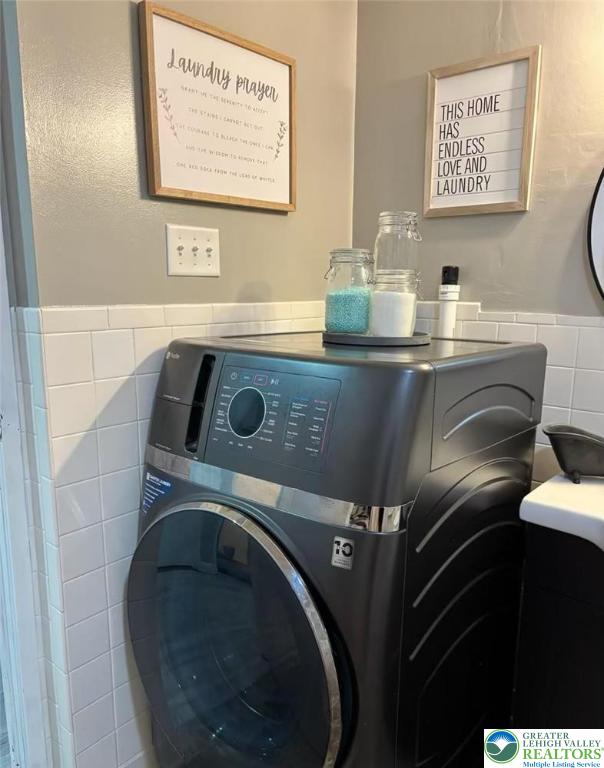 3300 Quarry St Unit B4, Whitehall Twp, PA 18052 - laundry room featuring tile walls and a wainscoted wall