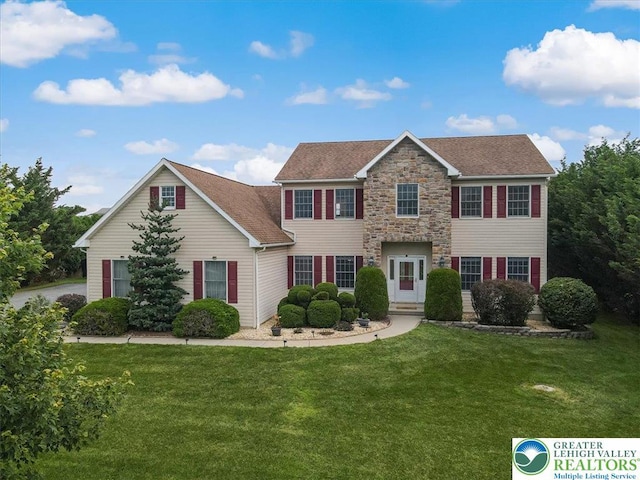 2804 Lehigh Ln, Upper Nazareth Twp, PA 18064 - colonial house with a front yard, stone siding, and a shingled roof