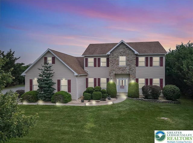 2804 Lehigh Ln, Upper Nazareth Twp, PA 18064 - colonial-style house with a yard, stone siding, and a shingled roof