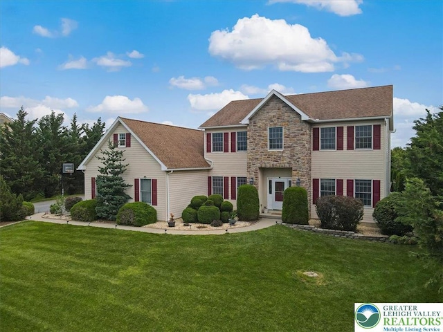 2804 Lehigh Ln, Upper Nazareth Twp, PA 18064 - colonial home with a front lawn, stone siding, and a shingled roof