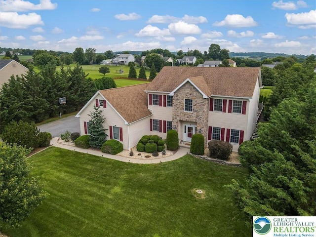 2804 Lehigh Ln, Upper Nazareth Twp, PA 18064 - colonial-style house featuring stone siding and a front lawn