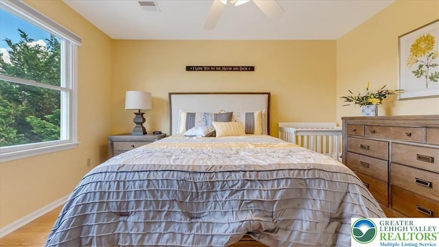 2804 Lehigh Ln, Upper Nazareth Twp, PA 18064 - bedroom with multiple windows, wood finished floors, and a ceiling fan