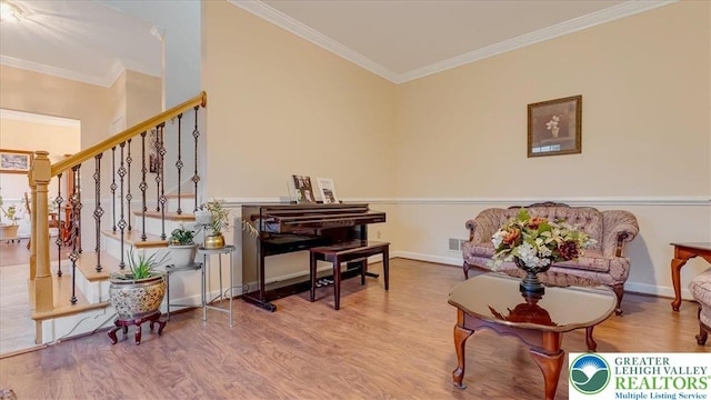 2804 Lehigh Ln, Upper Nazareth Twp, PA 18064 - sitting room with wood finished floors, ornamental molding, and stairway