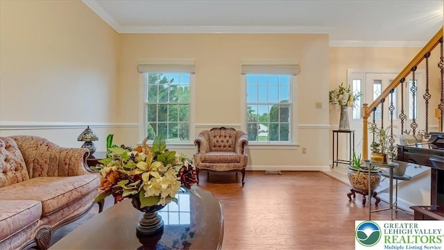 2804 Lehigh Ln, Upper Nazareth Twp, PA 18064 - living room with wood finished floors, stairs, plenty of natural light, and crown molding
