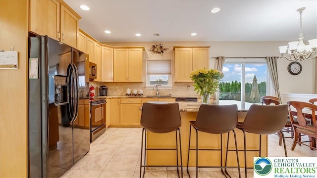 2804 Lehigh Ln, Upper Nazareth Twp, PA 18064 - kitchen featuring black fridge with ice dispenser, light brown cabinetry, electric range oven, a chandelier, and tasteful backsplash