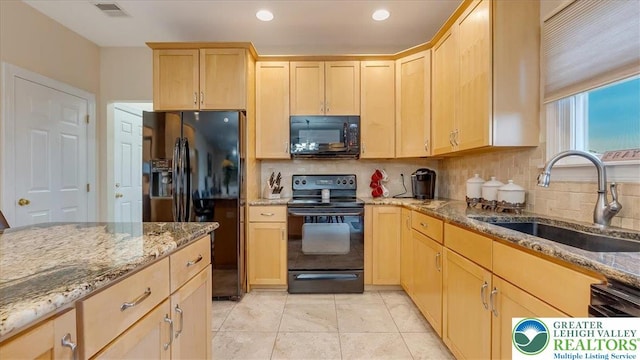 2804 Lehigh Ln, Upper Nazareth Twp, PA 18064 - kitchen with black appliances, light brown cabinetry, light stone countertops, backsplash, and recessed lighting