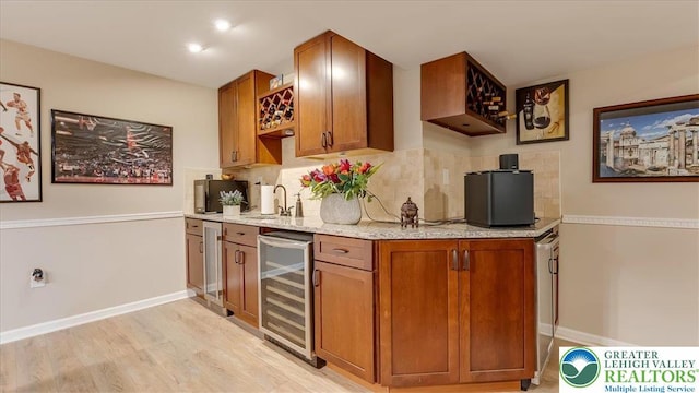 2804 Lehigh Ln, Upper Nazareth Twp, PA 18064 - kitchen with beverage cooler, tasteful backsplash, and brown cabinets