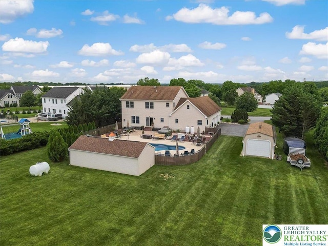 2804 Lehigh Ln, Upper Nazareth Twp, PA 18064 - rear view of house featuring a patio, a fenced backyard, an outbuilding, a garage, and an outdoor hangout area