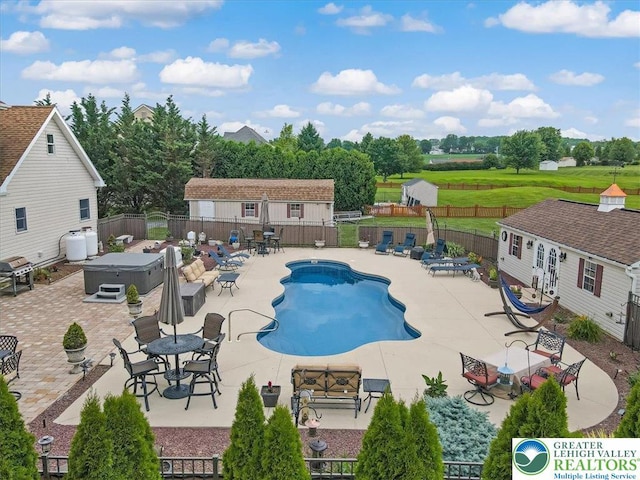 2804 Lehigh Ln, Upper Nazareth Twp, PA 18064 - community pool with a hot tub, a fenced backyard, a patio, and an outbuilding