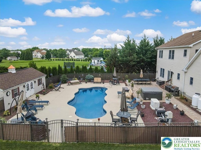 2804 Lehigh Ln, Upper Nazareth Twp, PA 18064 - view of swimming pool with a hot tub, a patio, and an outdoor structure
