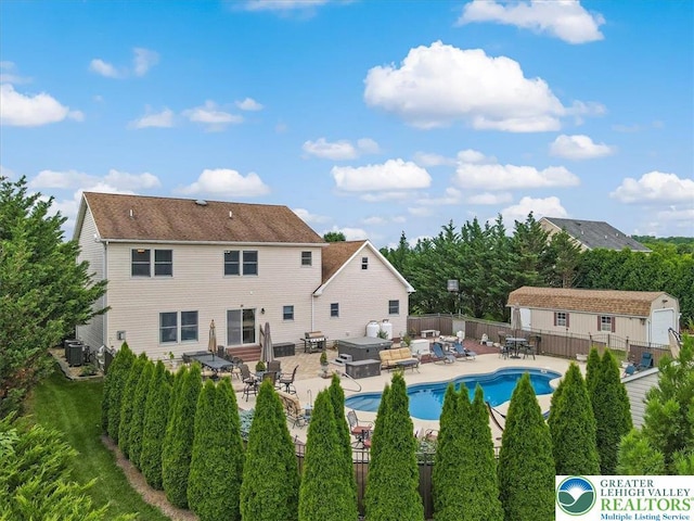 2804 Lehigh Ln, Upper Nazareth Twp, PA 18064 - rear view of house featuring a patio area, a fenced backyard, entry steps, outdoor dining area, and an outdoor structure