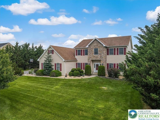 2804 Lehigh Ln, Upper Nazareth Twp, PA 18064 - colonial house featuring a front lawn, stone siding, and a shingled roof