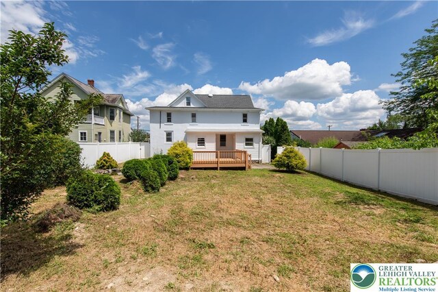 5734 Rte 873, North Whitehall Twp, PA 18078 - back of property featuring a fenced backyard, a deck, and stucco siding