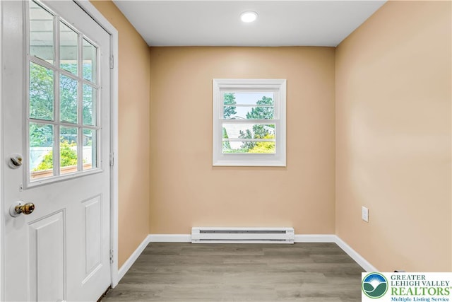 5734 Rte 873, North Whitehall Twp, PA 18078 - doorway to outside with a baseboard radiator, wood finished floors, and recessed lighting