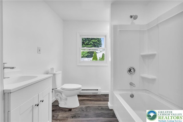 5734 Rte 873, North Whitehall Twp, PA 18078 - bathroom featuring a baseboard heating unit, vanity, wood finished floors, and shower / washtub combination