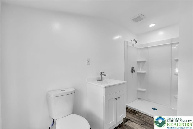 5734 Rte 873, North Whitehall Twp, PA 18078 - full bathroom with wood finished floors, vanity, and a shower