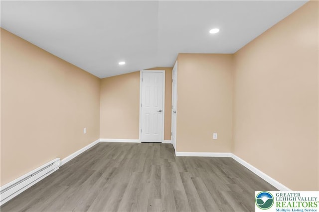 5734 Rte 873, North Whitehall Twp, PA 18078 - spare room with a baseboard radiator, wood finished floors, and recessed lighting