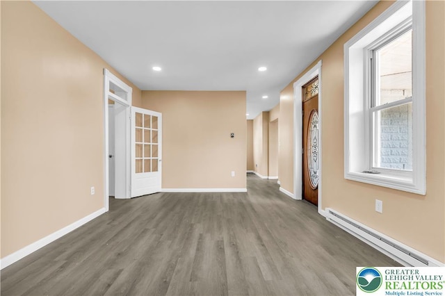5734 Rte 873, North Whitehall Twp, PA 18078 - unfurnished living room with a baseboard heating unit, wood finished floors, and recessed lighting