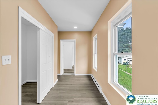 5734 Rte 873, North Whitehall Twp, PA 18078 - hallway with a baseboard heating unit, healthy amount of natural light, wood finished floors, and recessed lighting