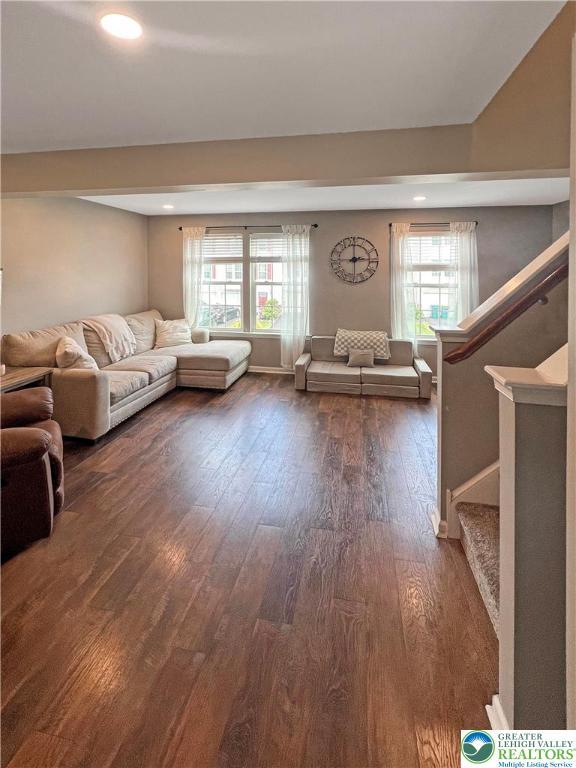 20 Gold Rose Ln, Palmer Twp, PA 18045 - living room featuring dark wood-style flooring, stairs, and recessed lighting