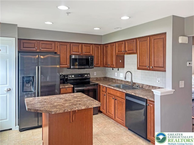 20 Gold Rose Ln, Palmer Twp, PA 18045 - kitchen with black appliances, a center island, backsplash, brown cabinetry, and recessed lighting