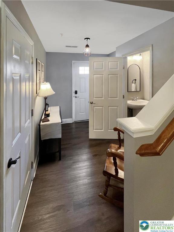 20 Gold Rose Ln, Palmer Twp, PA 18045 - entrance foyer featuring dark wood-style flooring and baseboards