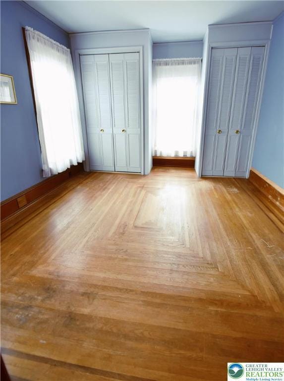 107 N Schanck Ave, Pen Argyl Boro, PA 18072 - unfurnished bedroom with multiple closets and baseboards