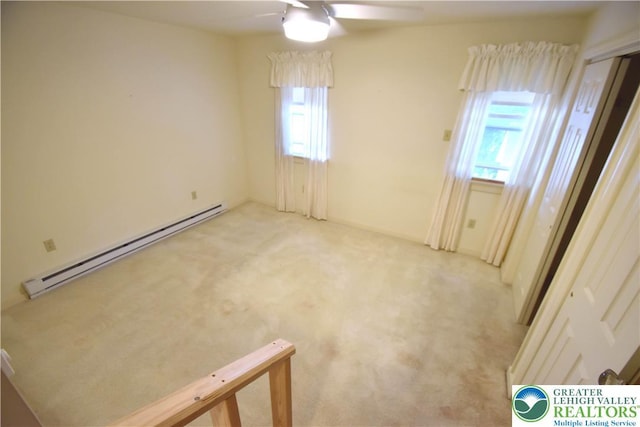 107 N Schanck Ave, Pen Argyl Boro, PA 18072 - unfurnished room featuring baseboard heating, plenty of natural light, a ceiling fan, and light carpet