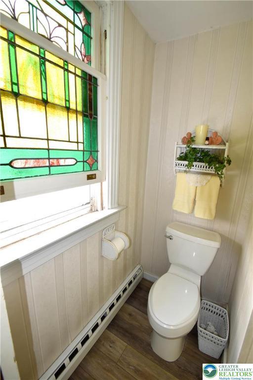 107 N Schanck Ave, Pen Argyl Boro, PA 18072 - bathroom with baseboard heating and wood finished floors