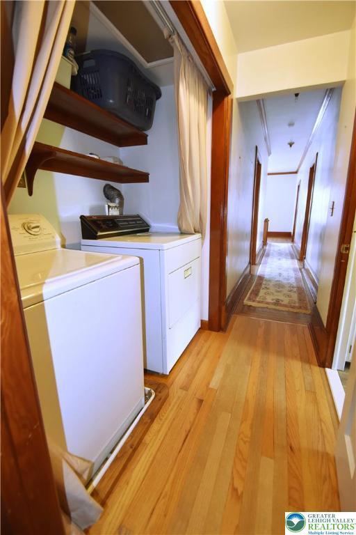 107 N Schanck Ave, Pen Argyl Boro, PA 18072 - washroom with washing machine and clothes dryer and light wood-style floors