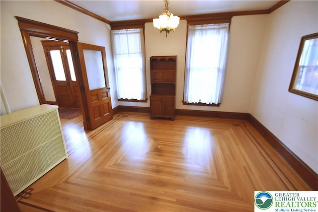 107 N Schanck Ave, Pen Argyl Boro, PA 18072 - entryway with a chandelier, radiator heating unit, and crown molding