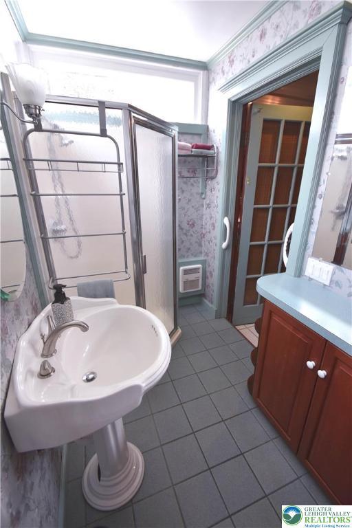 107 N Schanck Ave, Pen Argyl Boro, PA 18072 - full bathroom with wallpapered walls, tile patterned flooring, and a stall shower