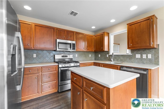 9 Stone Crk, Palmer Twp, PA 18045 - kitchen featuring appliances with stainless steel finishes, dark wood-style floors, light countertops, a kitchen island, and recessed lighting