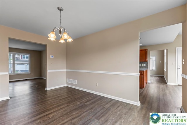 9 Stone Crk, Palmer Twp, PA 18045 - unfurnished room featuring dark wood finished floors and a chandelier