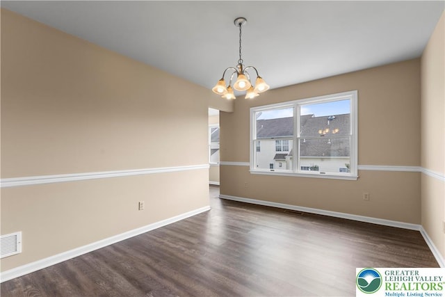 9 Stone Crk, Palmer Twp, PA 18045 - unfurnished room with a chandelier and dark wood finished floors