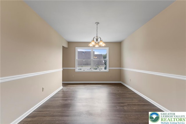 9 Stone Crk, Palmer Twp, PA 18045 - empty room with a chandelier and dark wood-style flooring