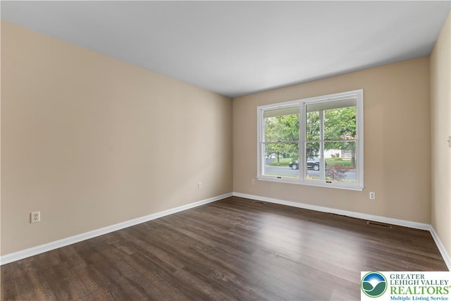 9 Stone Crk, Palmer Twp, PA 18045 - spare room featuring dark wood finished floors and baseboards