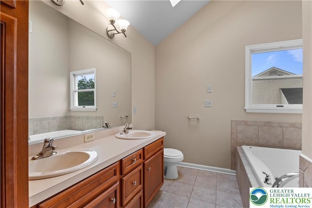 9 Stone Crk, Palmer Twp, PA 18045 - full bath featuring lofted ceiling, a garden tub, double vanity, and tile patterned flooring