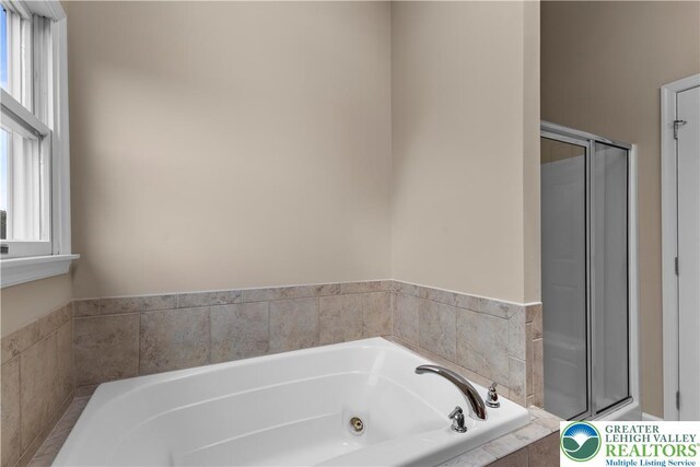 9 Stone Crk, Palmer Twp, PA 18045 - bathroom with plenty of natural light, a whirlpool tub, and a shower stall
