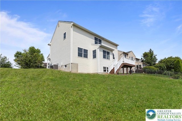 9 Stone Crk, Palmer Twp, PA 18045 - rear view of property with stairway and a deck