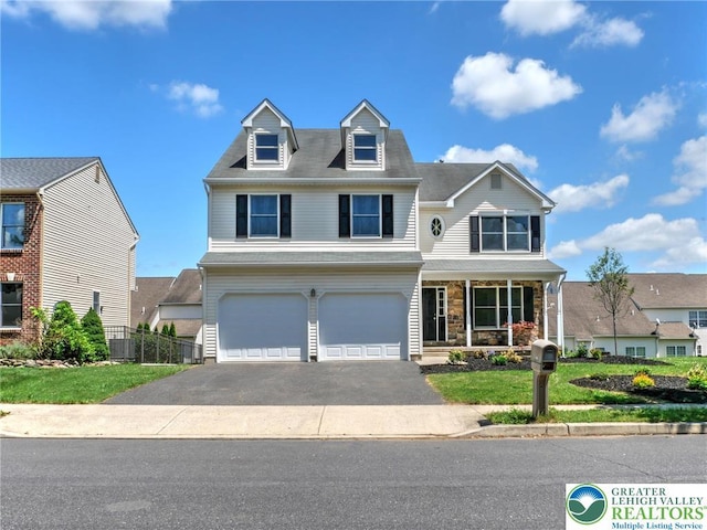 9 Stone Crk, Palmer Twp, PA 18045 - view of front of house featuring asphalt driveway, a garage, a porch, and stone siding