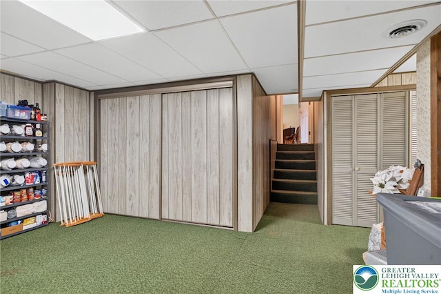 56 Hearthstone Dr, Exeter Twp, PA 19606 - finished basement featuring carpet flooring, stairs, a drop ceiling, and wood walls