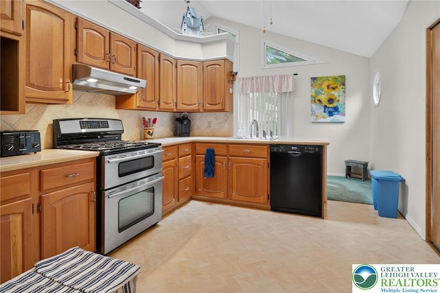 56 Hearthstone Dr, Exeter Twp, PA 19606 - kitchen featuring black dishwasher, under cabinet range hood, range with two ovens, vaulted ceiling, and backsplash