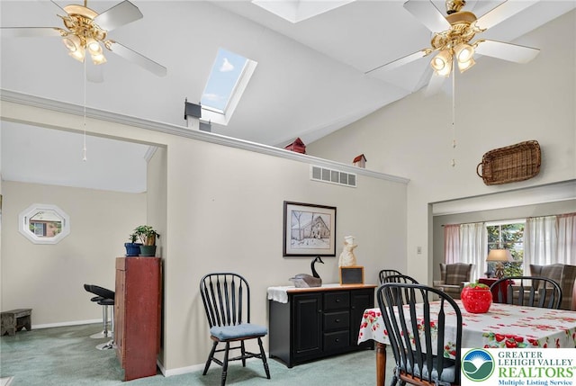 56 Hearthstone Dr, Exeter Twp, PA 19606 - carpeted dining room with a ceiling fan, a skylight, and high vaulted ceiling