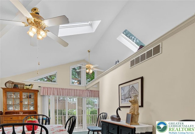 56 Hearthstone Dr, Exeter Twp, PA 19606 - dining space with a ceiling fan, high vaulted ceiling, and a skylight