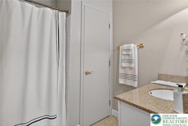 56 Hearthstone Dr, Exeter Twp, PA 19606 - full bath with vanity, tile patterned floors, and a shower with curtain