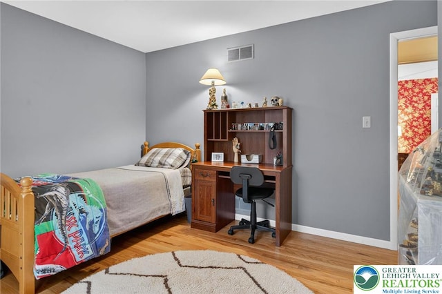 56 Hearthstone Dr, Exeter Twp, PA 19606 - bedroom featuring wood finished floors and an office area
