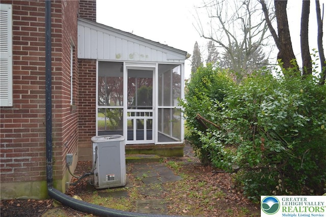 1424 Westgate Dr, Hanover Twp, PA 18017 - view of property exterior featuring a sunroom and brick siding